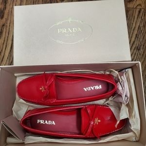 Red patent leather Prada loafers